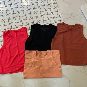 Lots of 4 Athleta tops